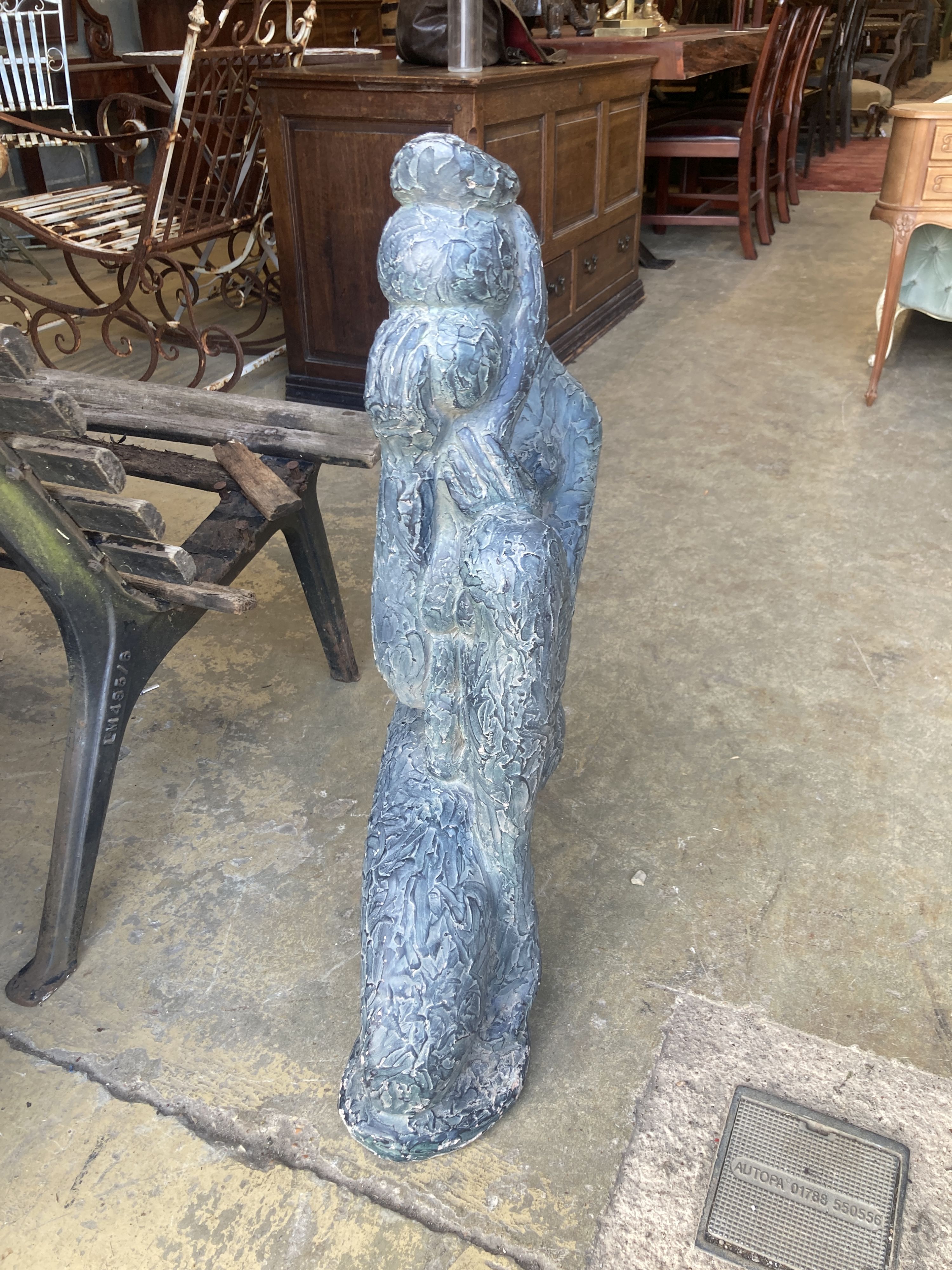 An Austin sculpture Durastone figure of a crouching girl